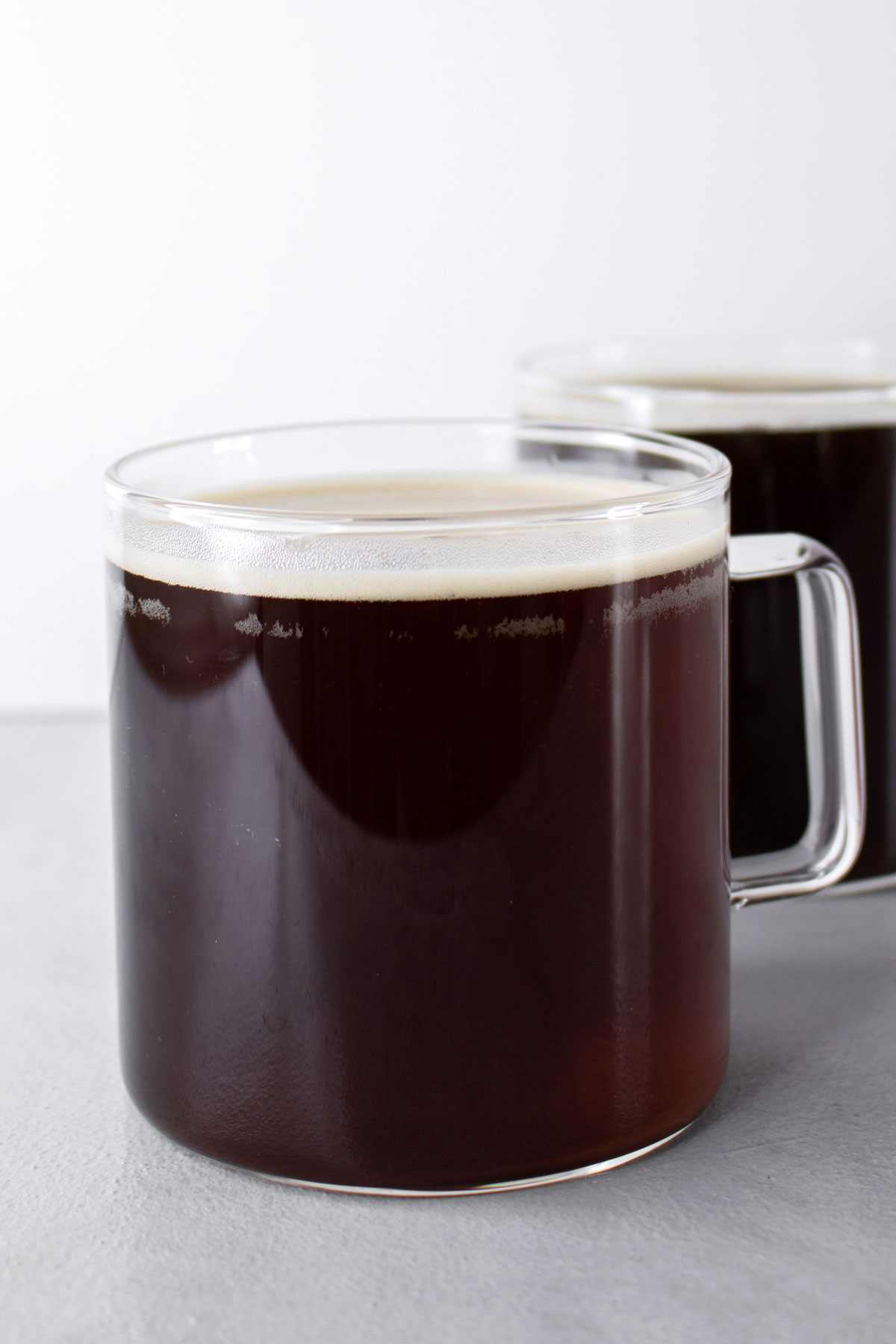 Americano coffee in 2 glass mugs.