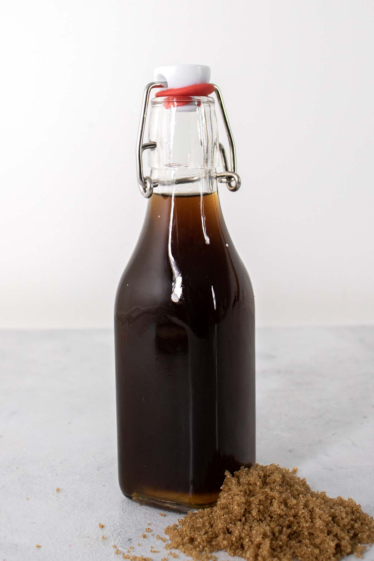 Homemade brown sugar syrup in a glass bottle.