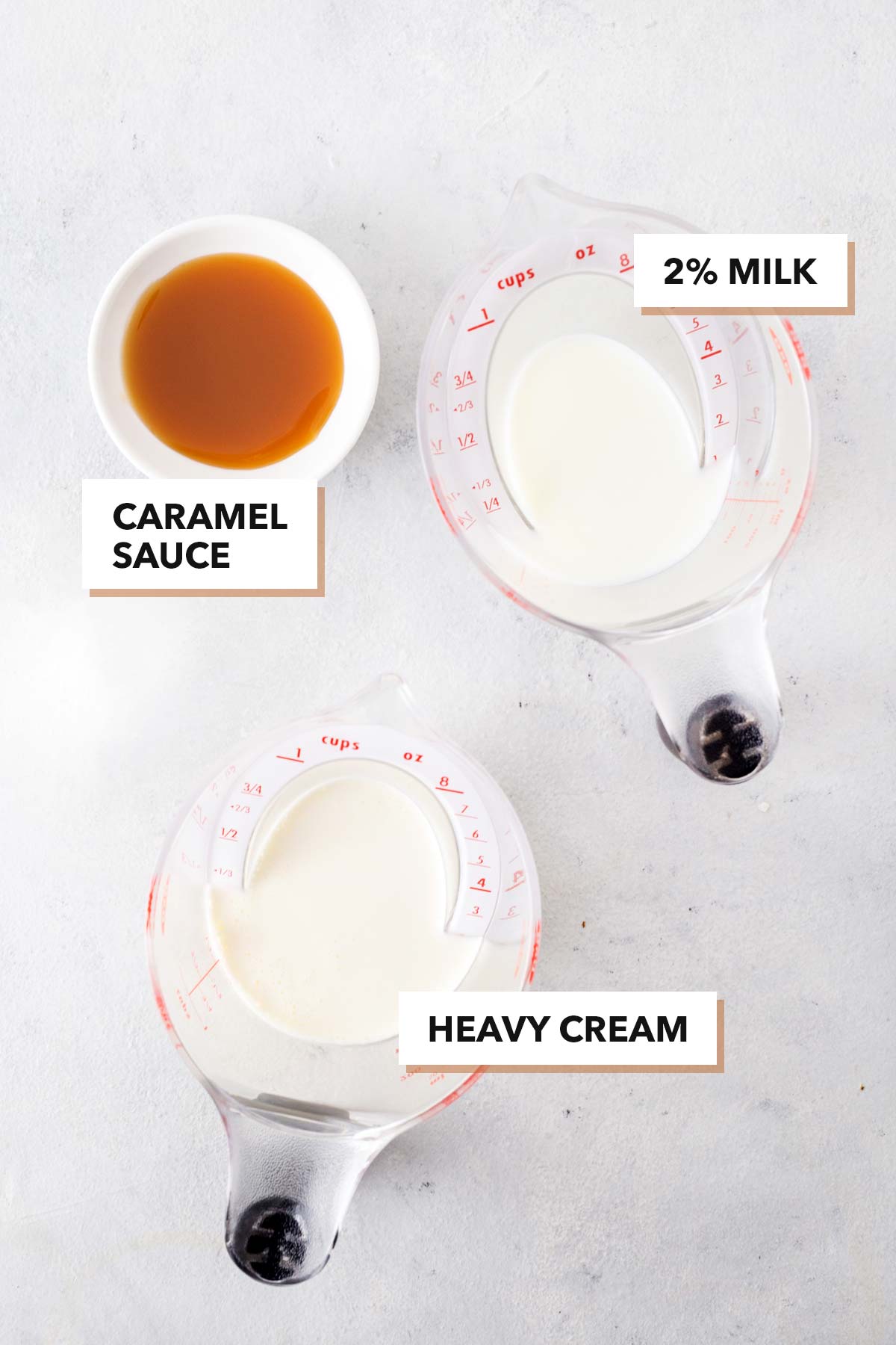 Caramel cold foam ingredients in measuring cups.