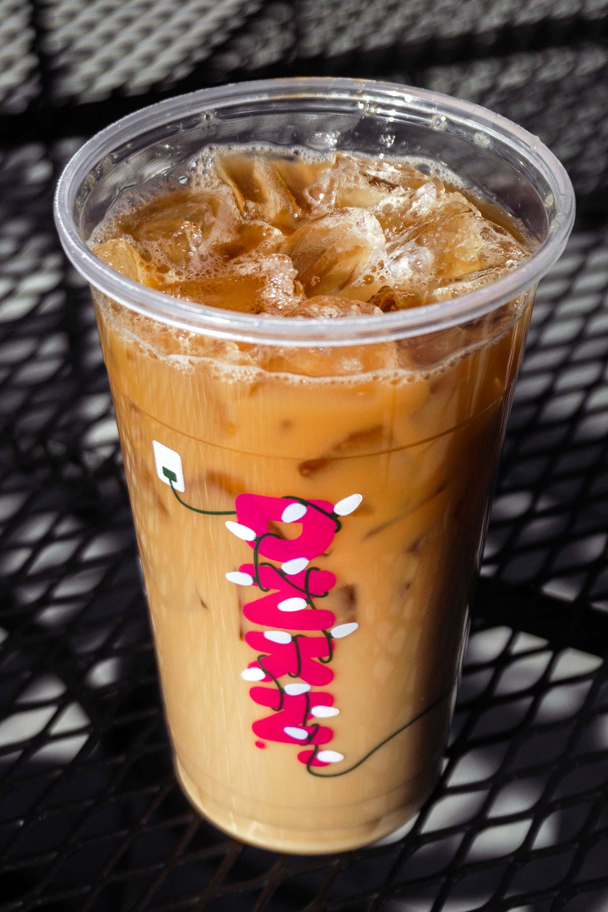 Dunkin' "The Charli" drink in a holiday Dunkin' cup.