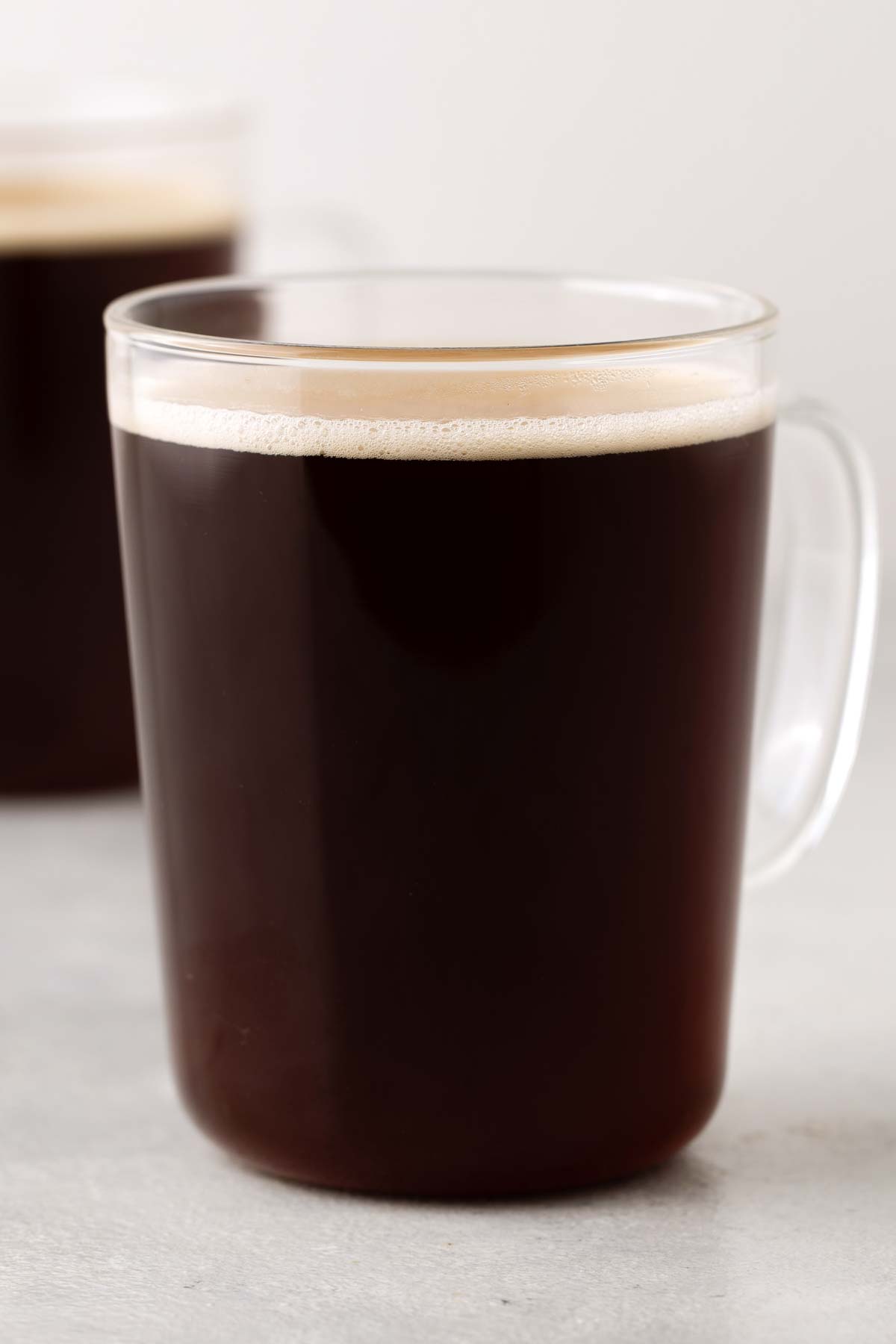 Americano coffee in a glass mug.