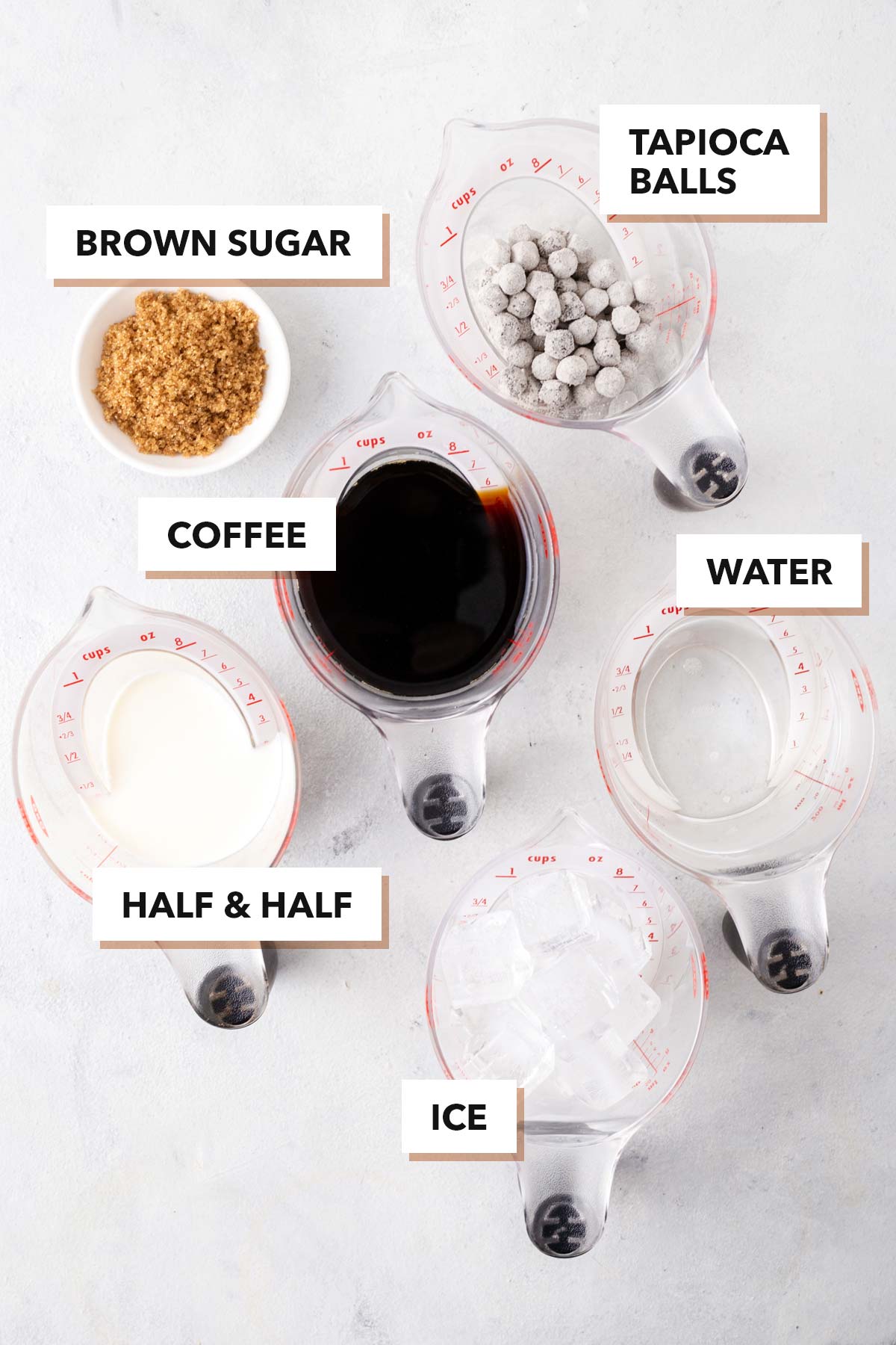 Iced Coffee Boba ingredients individually in measuring cups and labeled.