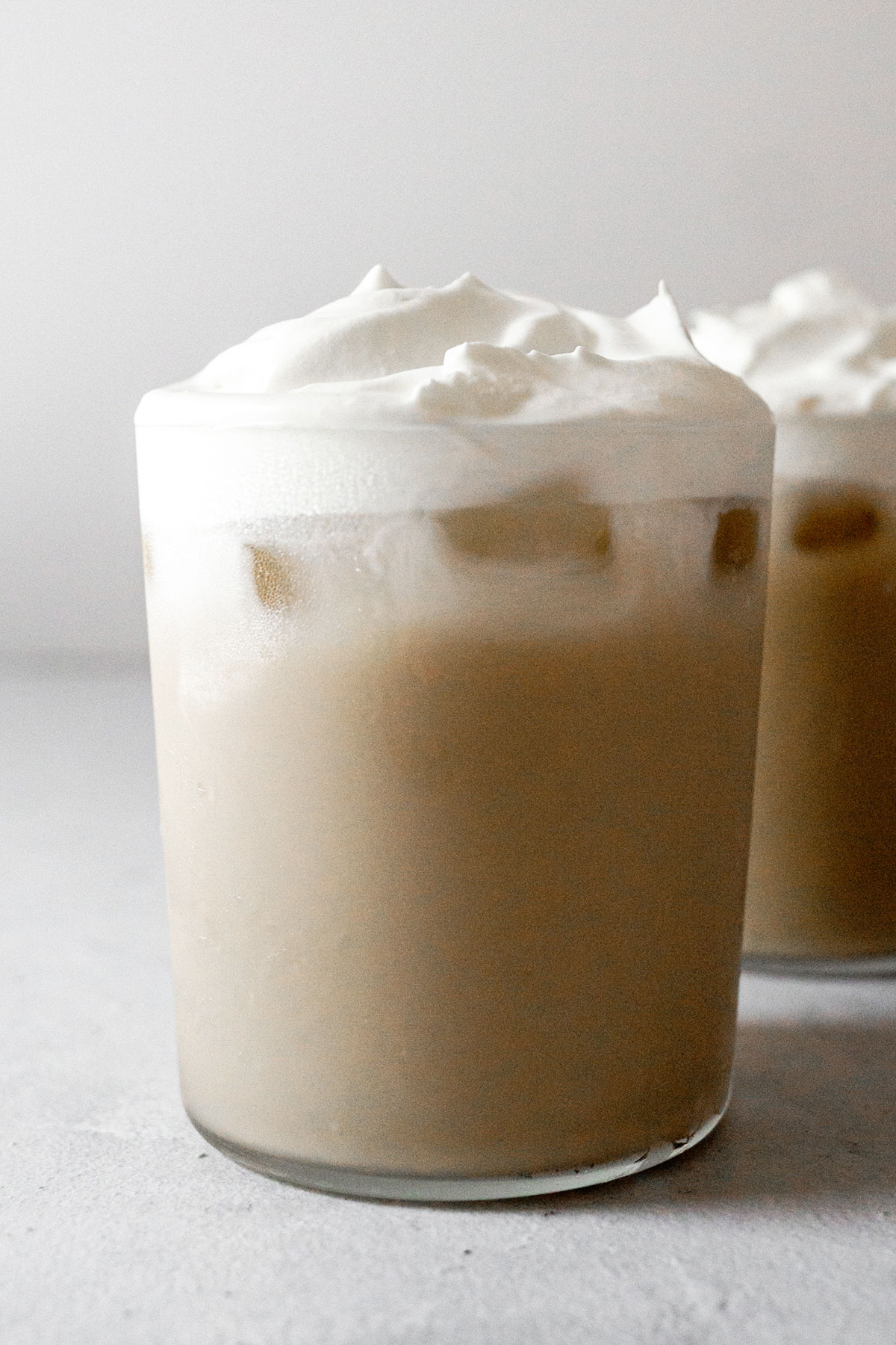 Iced Vanilla Latte in two cups.