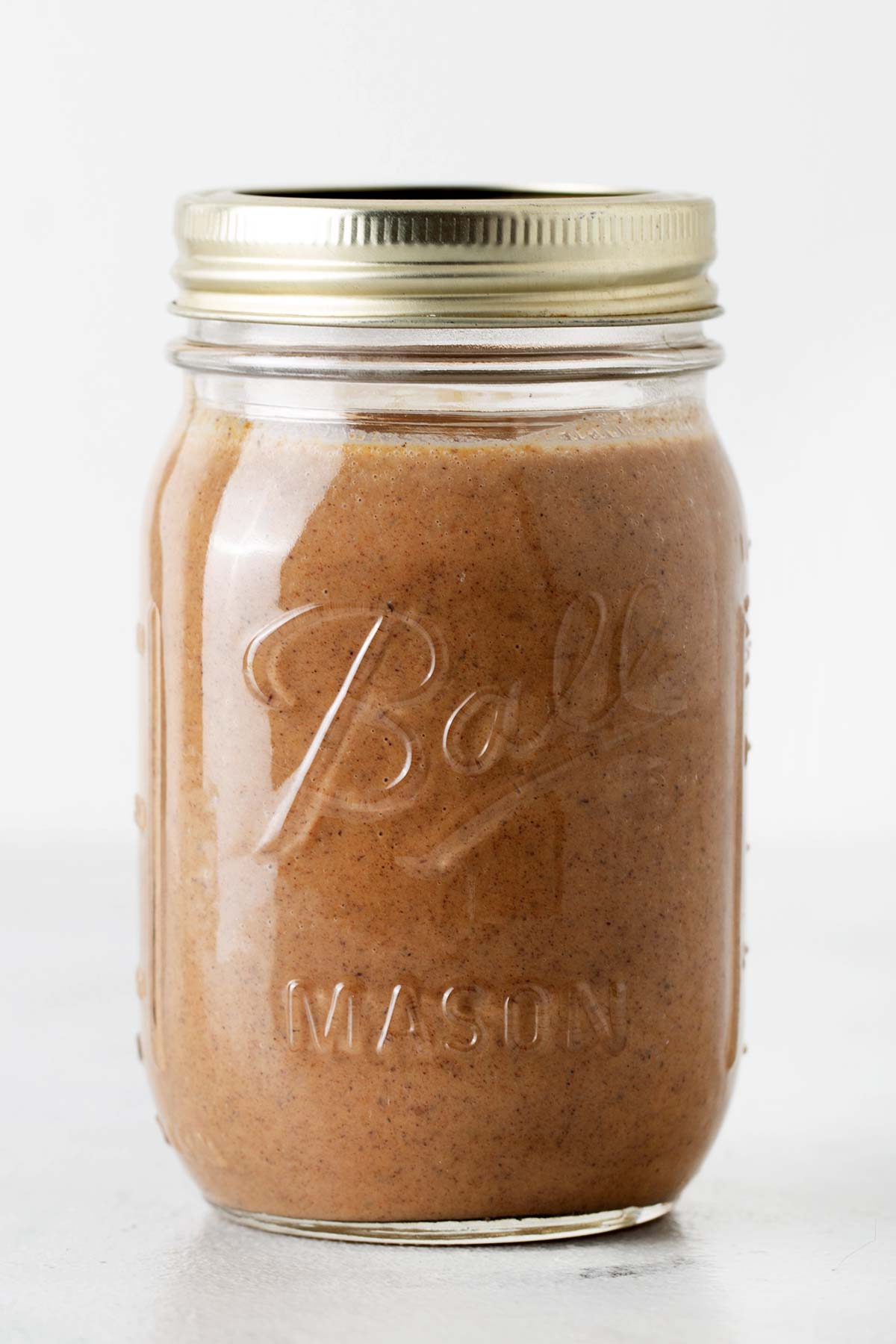 Pumpkin Spice Sauce in a sealed Mason jar.