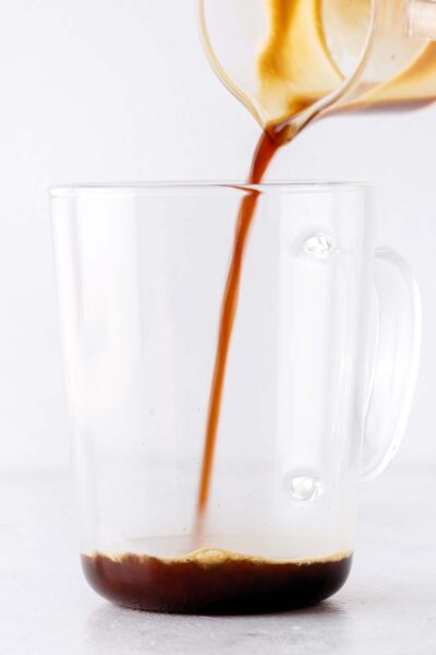 Espresso being poured into a cup. 
