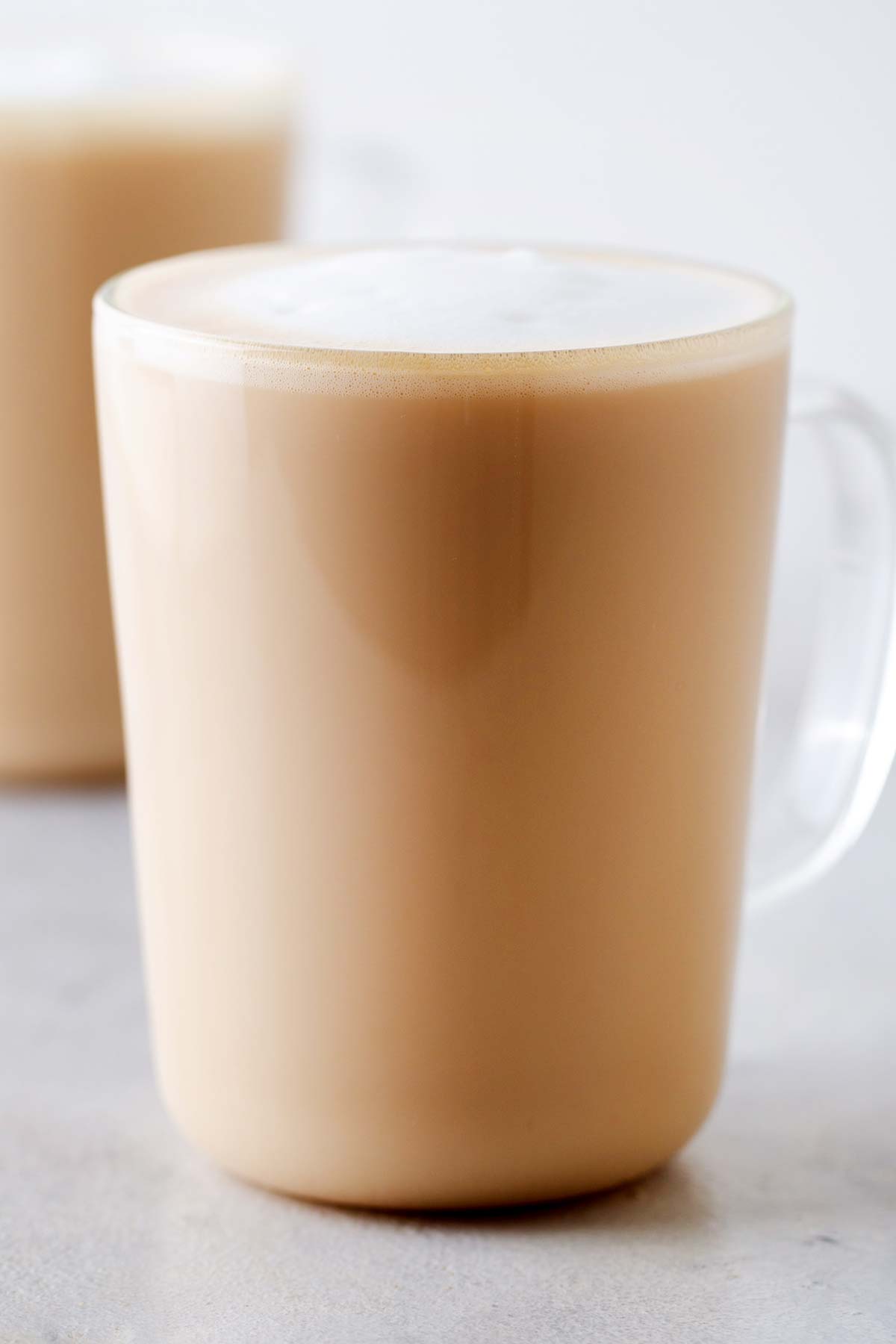 Starbucks Blonde Vanilla Latte copycat drink in a clear, glass mug.