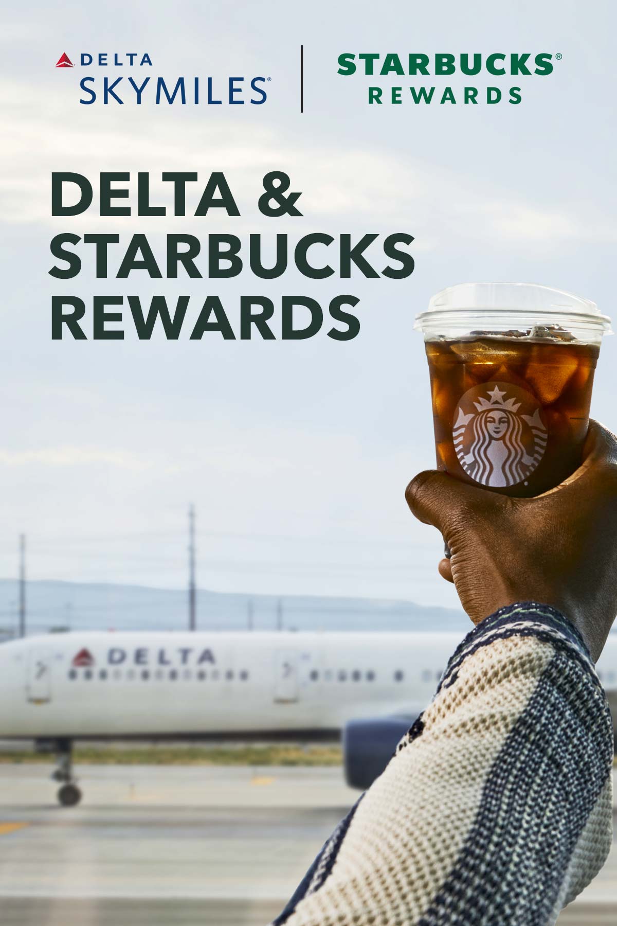 Delta and Starbucks Rewards text on photo of hand holding Starbucks iced coffee in front of a Delta plane.
