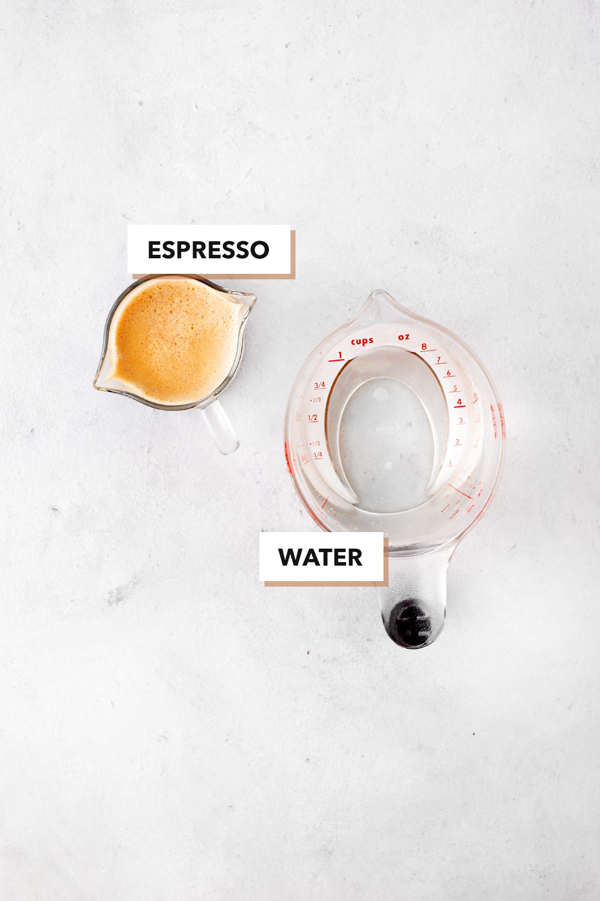 Starbucks Americano Copycat ingredients in clear measuring cups.