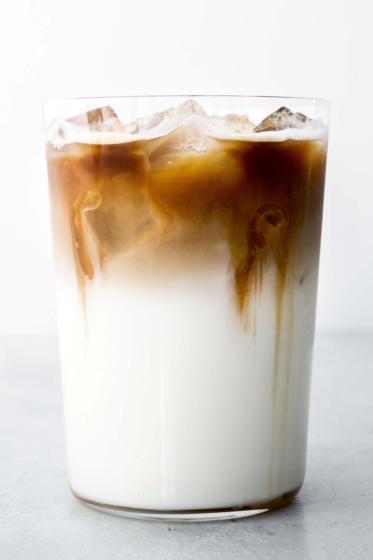 Iced Caramel Macchiato drink in a glass cup.