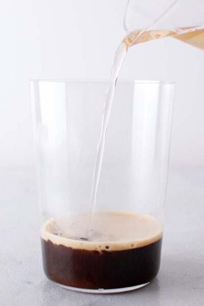 Vanilla poured into a cup with espresso. 
