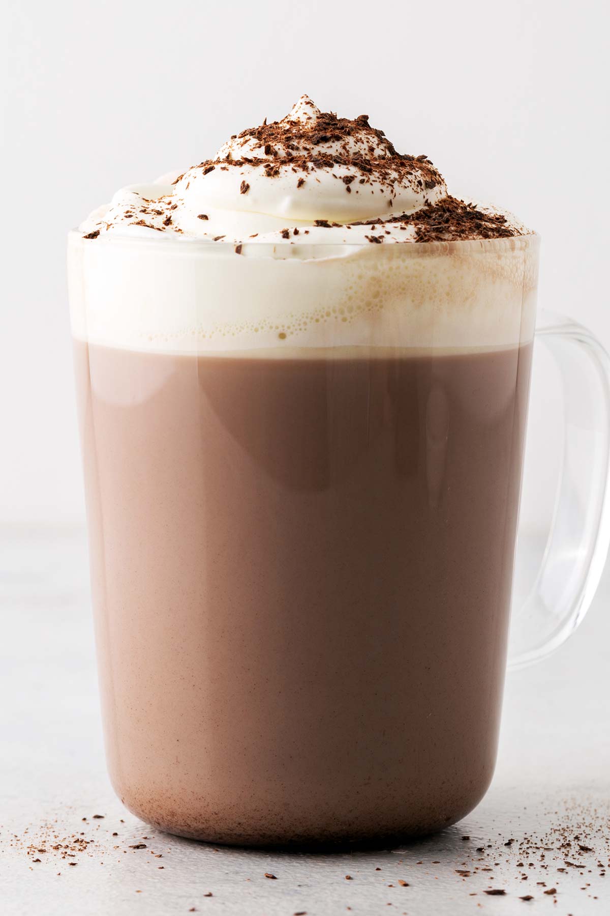 Peppermint Hot Chocolate in a glass mug with whipped cream.