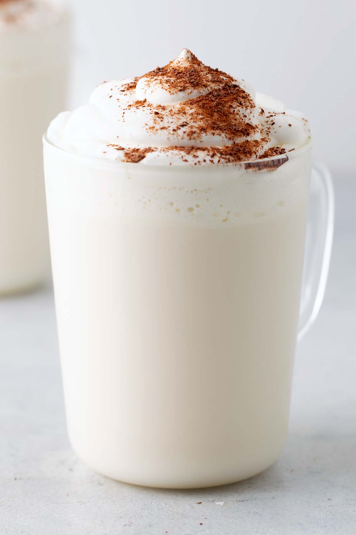 Starbucks Peppermint White Hot Chocolate Copycat Recipe in clear glass.