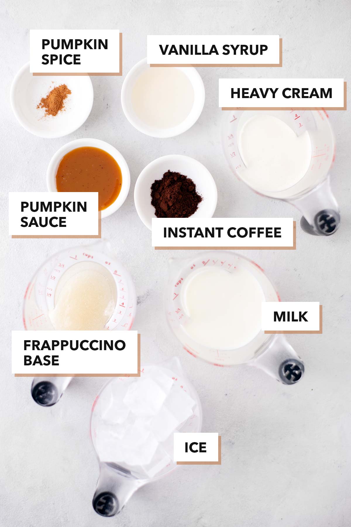 Starbucks Pumpkin Spice Frappuccino Copycat ingredients in bowls and measuring cups.