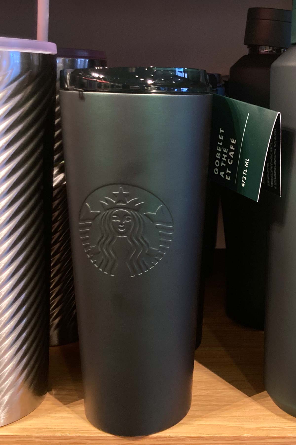 Starbucks January 2023 Refill Tumbler on a Starbucks shelf.