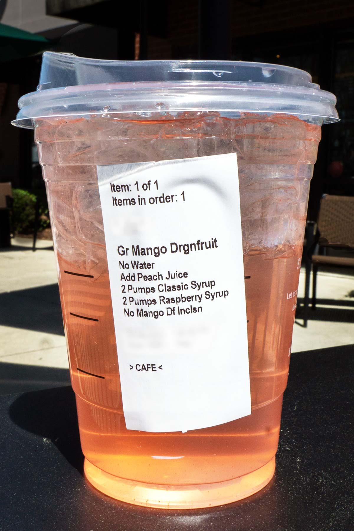 TikTok Rose Gold Refresher drink with ingredients/order sticker on the side of the cup.
