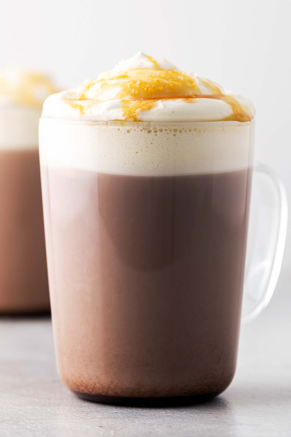 Salted Caramel Hot Chocolate in a cup with whipped cream.