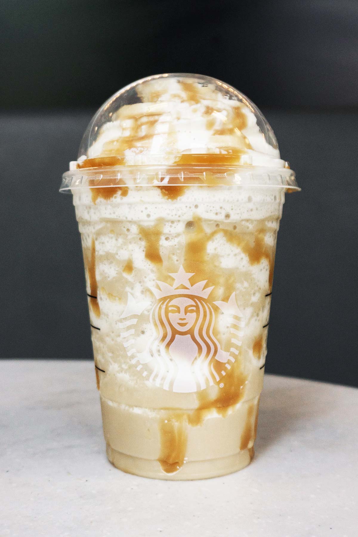 Starbucks Butterbeer Frappuccino in a plastic cup.