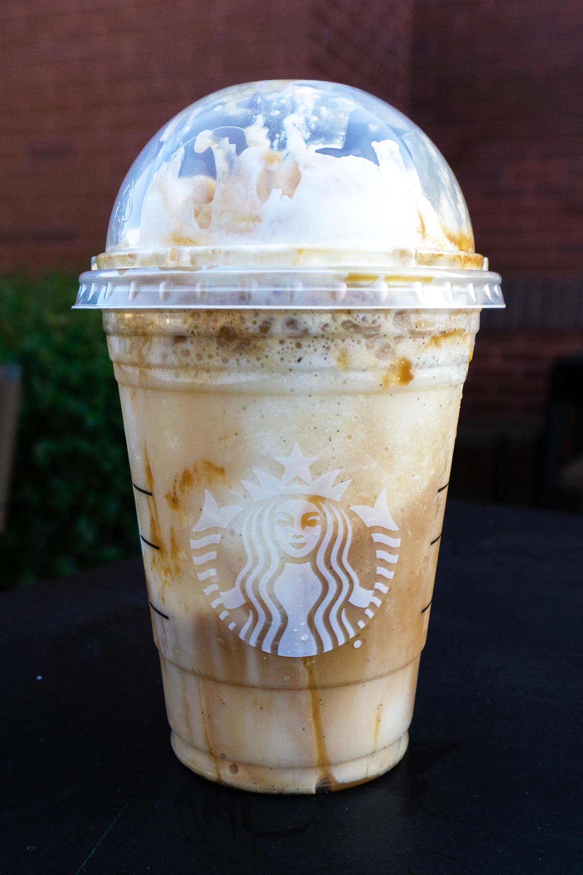 Caramel Macchiato Frappuccino in a Starbucks cup.