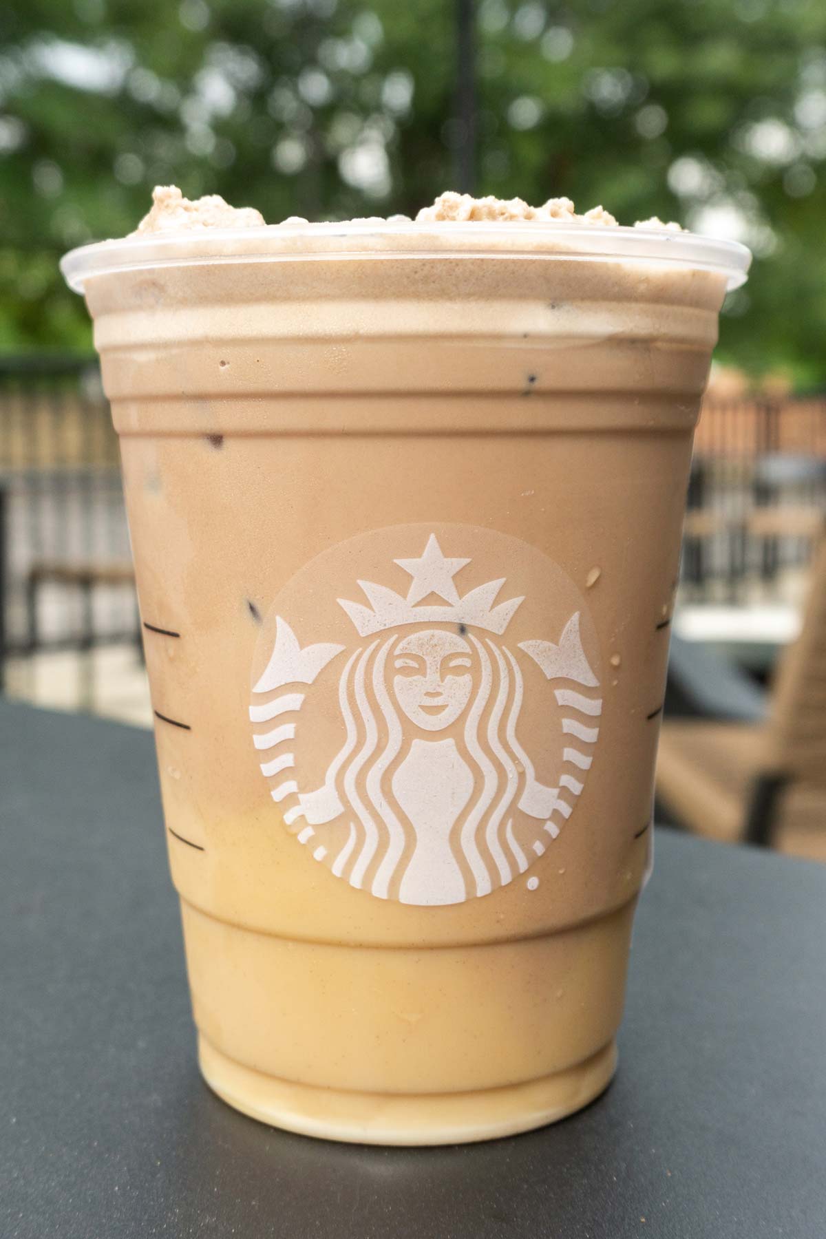 Cookies and Cream Cold Brew, a Starbucks secret menu drink, in a Starbucks cup.
