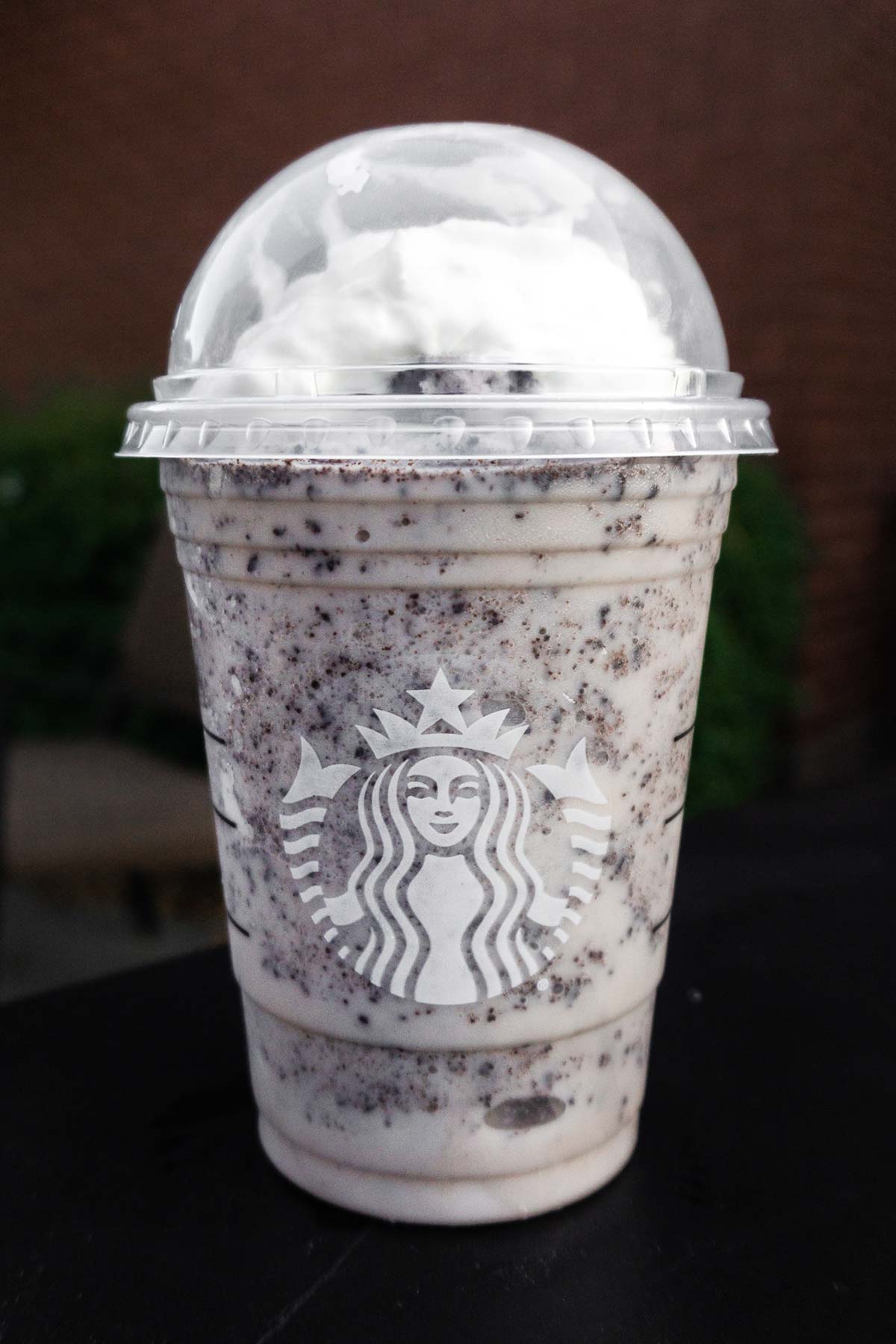 Cookies and Cream Frappuccino in a Starbucks cup.
