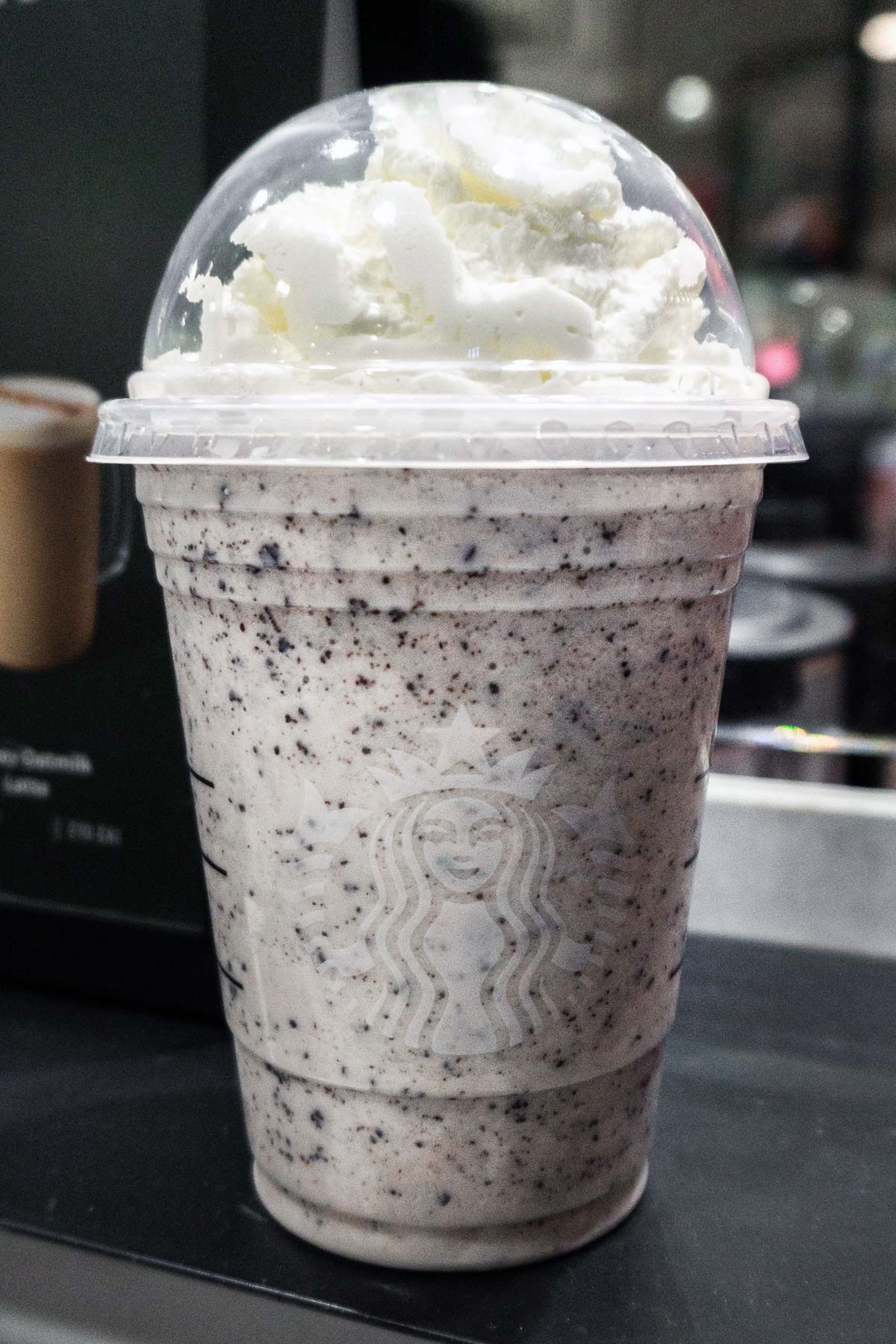 Cookies and Cream Frappuccino in a Starbucks cup.