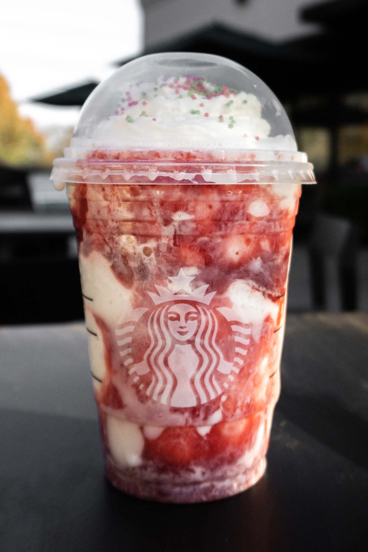 Vanilla Frappuccino with strawberry puree swirled in.