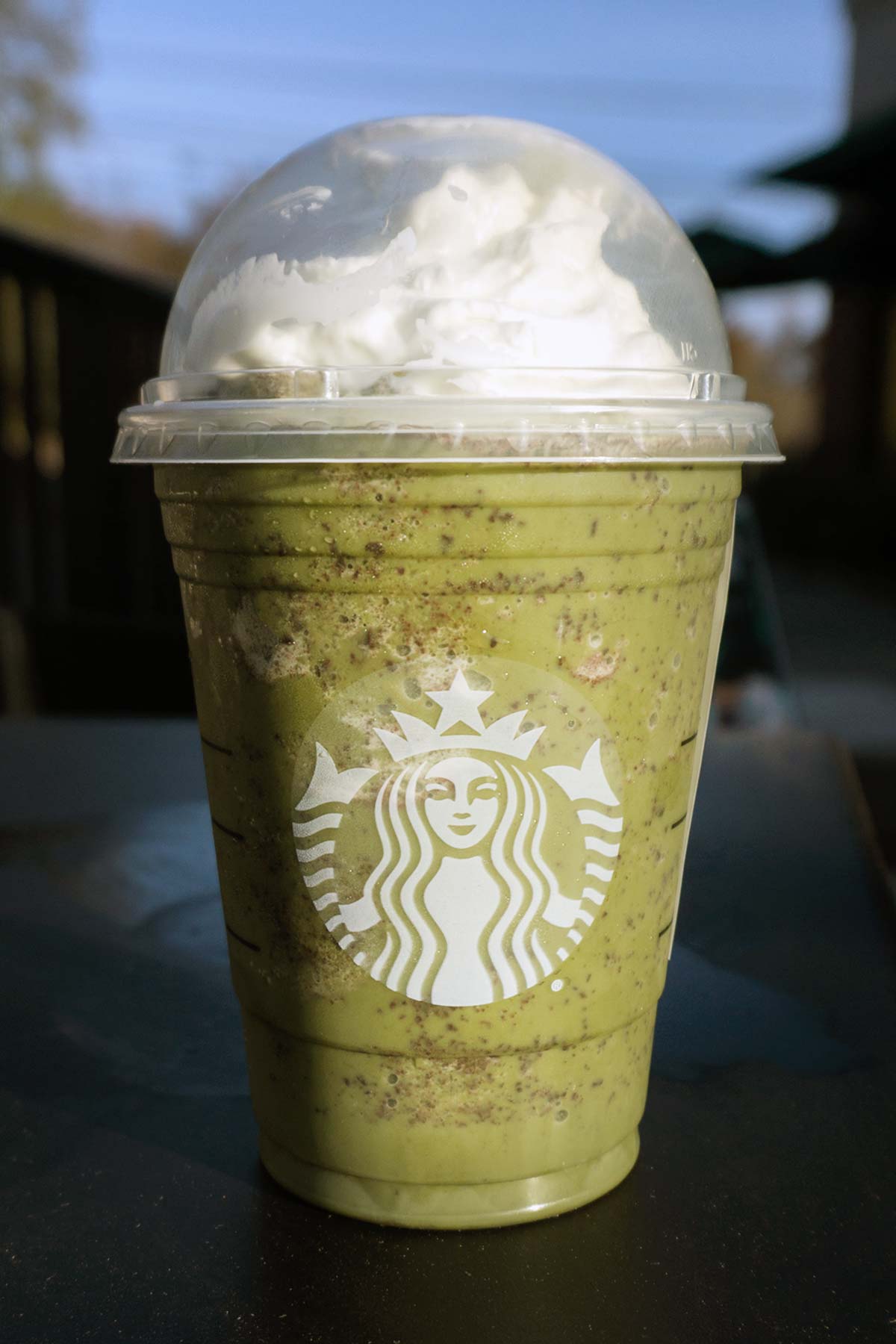 Thin Mint Frappuccino in a grande cup with lid.