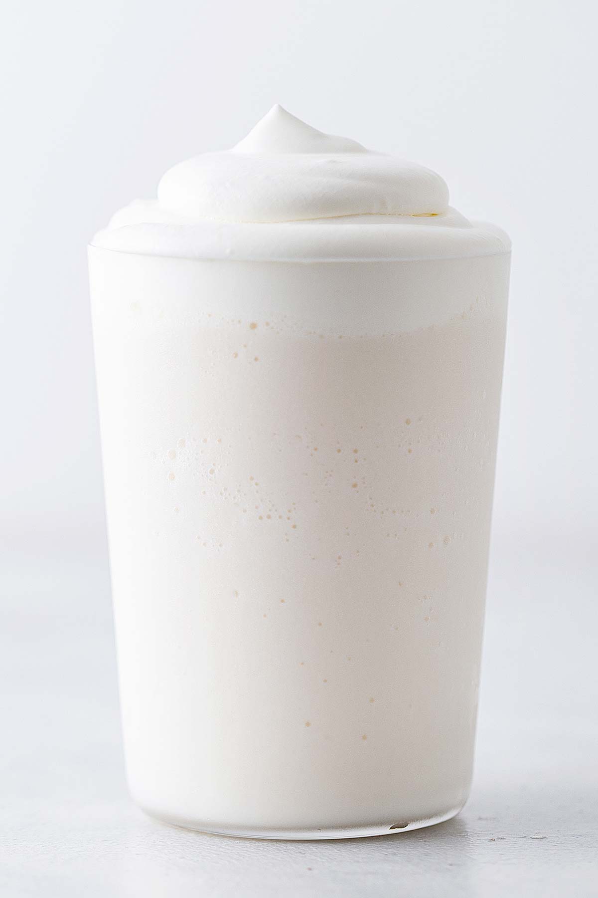 White Chocolate Frappuccino in a cup with whipped cream.