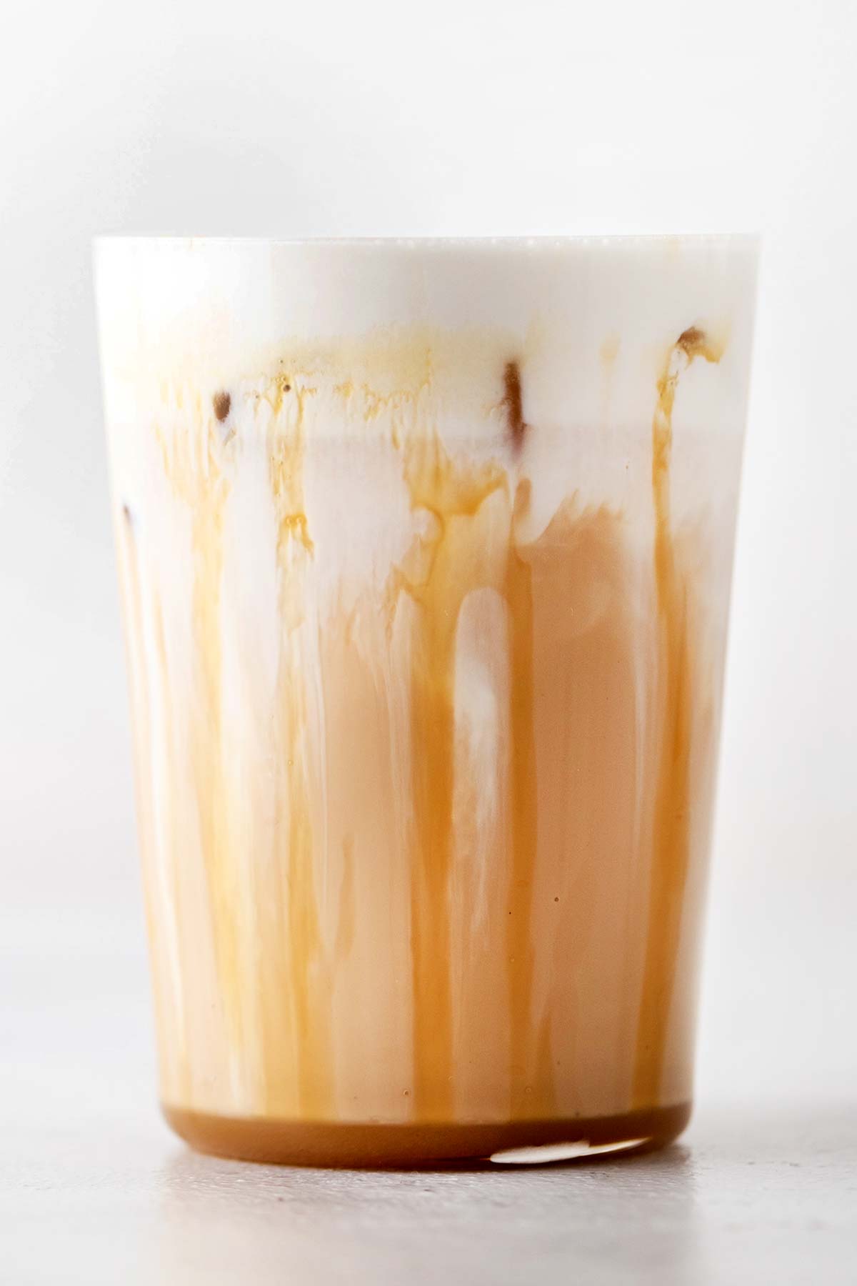 TikTok Starbucks Iced White Mocha copycat drink in a cup with sweet cream foam.