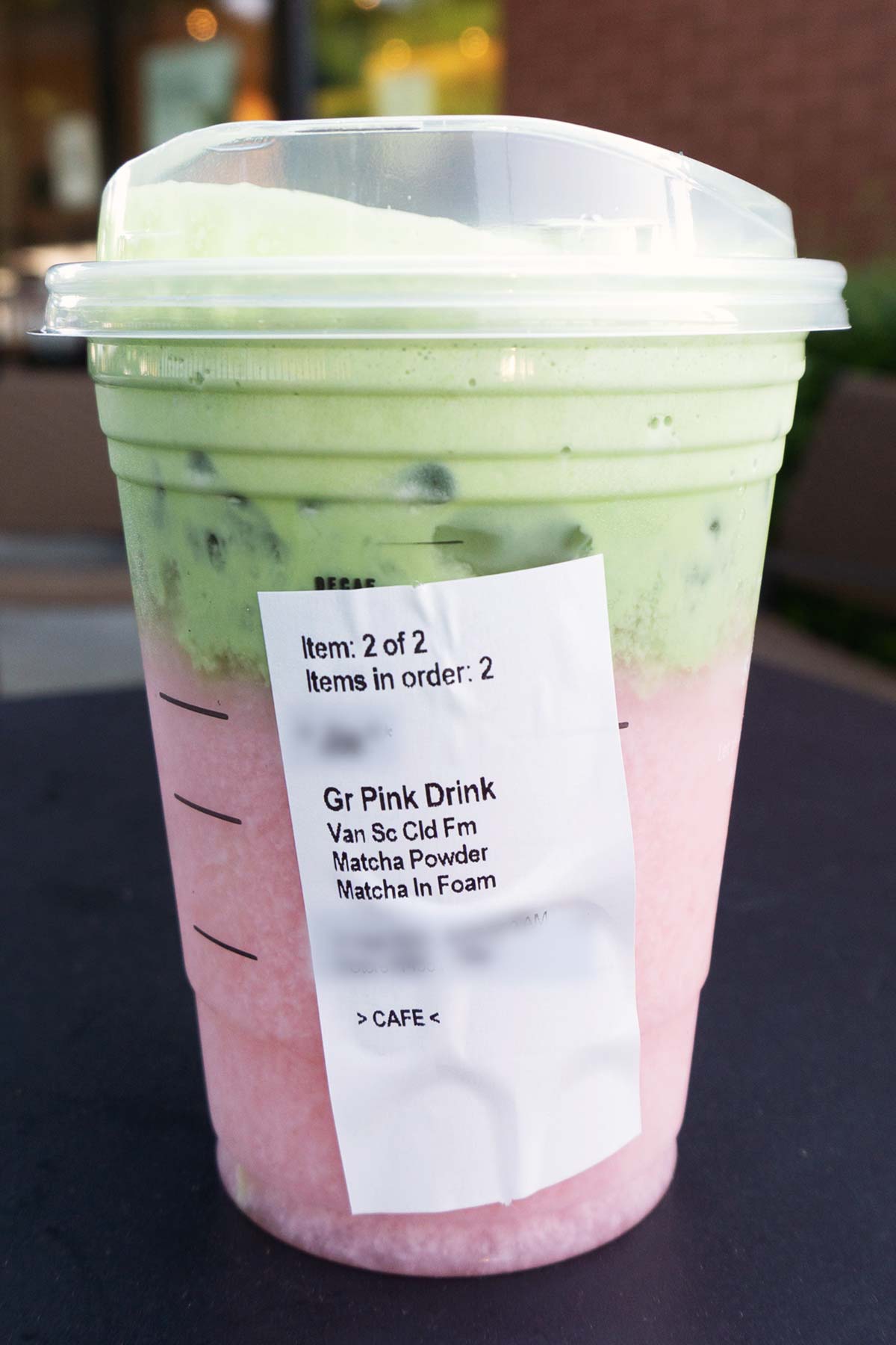 TikTok Matcha Pink Drink in a Starbucks cup with order sticker showing.