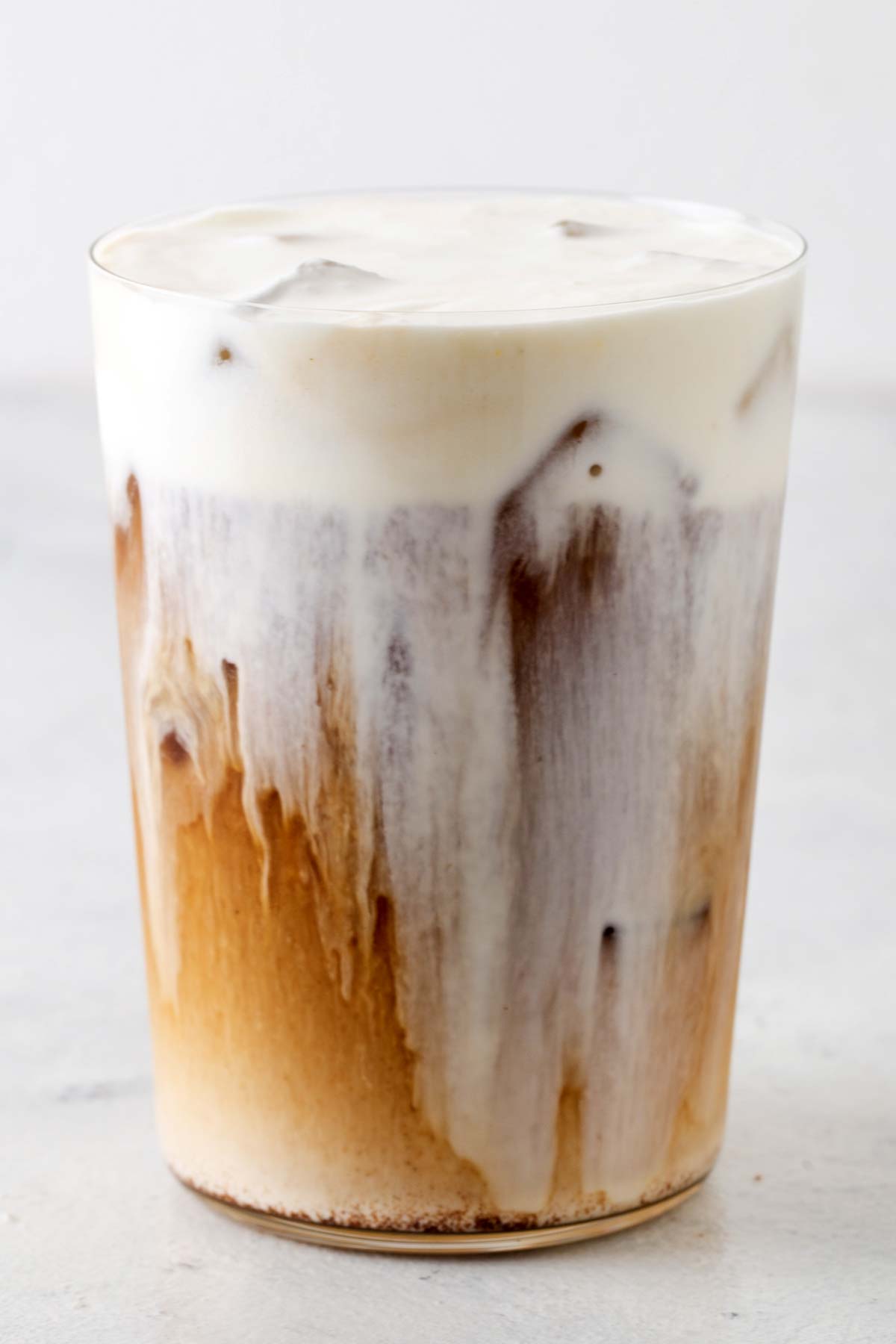 Cold Foam in a cup with iced coffee.